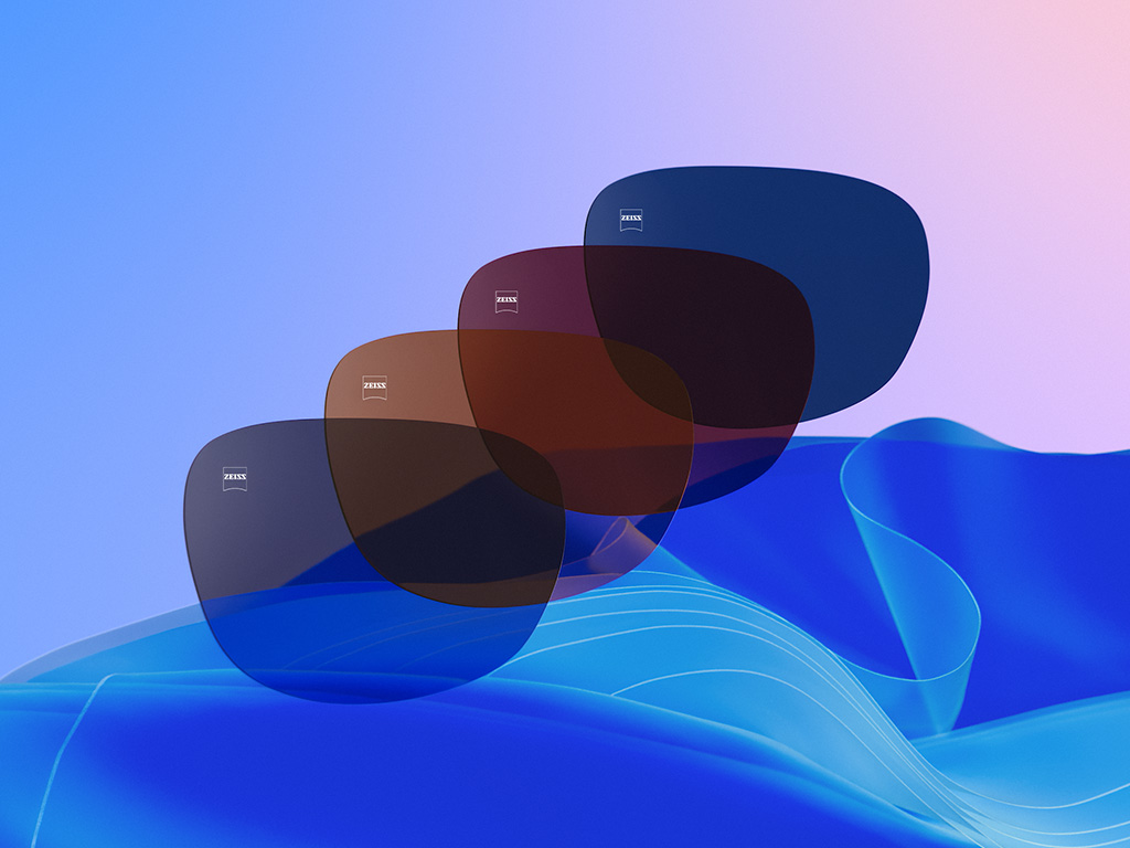 Ilustração 3D gerada por computador de quatro lentes coloridas em Dusk Grey, Copper Brown, Burgundy e Midnight Blue.