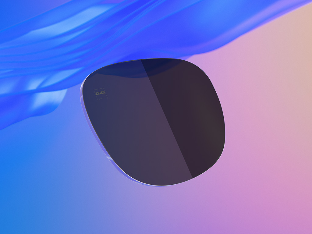 Ilustração 3D gerada por computador de uma lente colorida de óculos de sol, com metade da lente com um nível de escurecimento menos acentuado do que a outra.