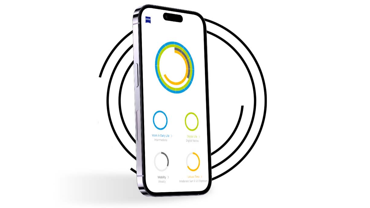 Um smartphone em frente a anéis pretos que mostra o perfil de um utilizador de "O Meu Perfil Visual" com anéis de cores diferentes. 